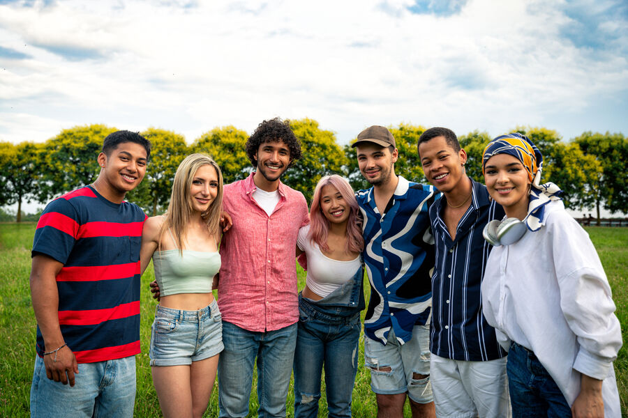 A diverse multigenerational group spending time together outdoors